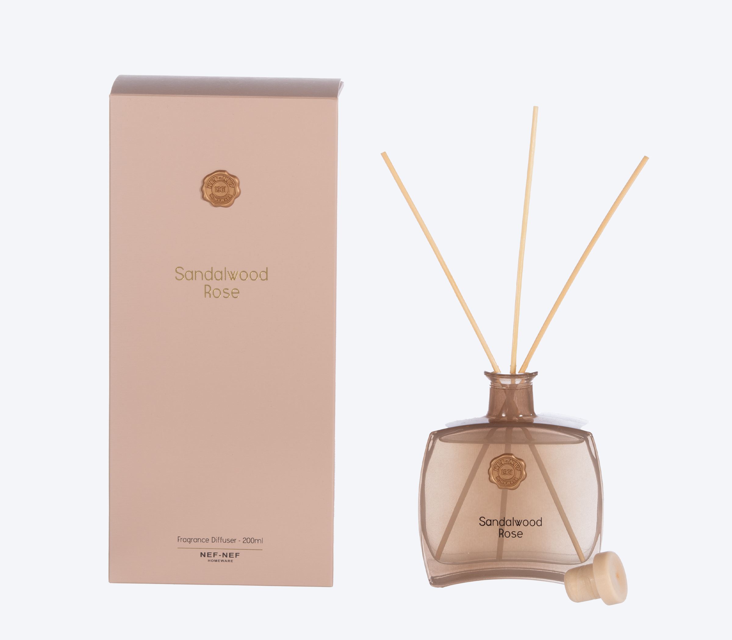 Sandalwood Rose reed diffuser with elegant citrus, rose, iris, and warm woody fragrance notes.