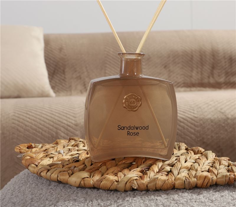 Sandalwood Rose reed diffuser with elegant citrus, rose, iris, and warm woody fragrance notes.